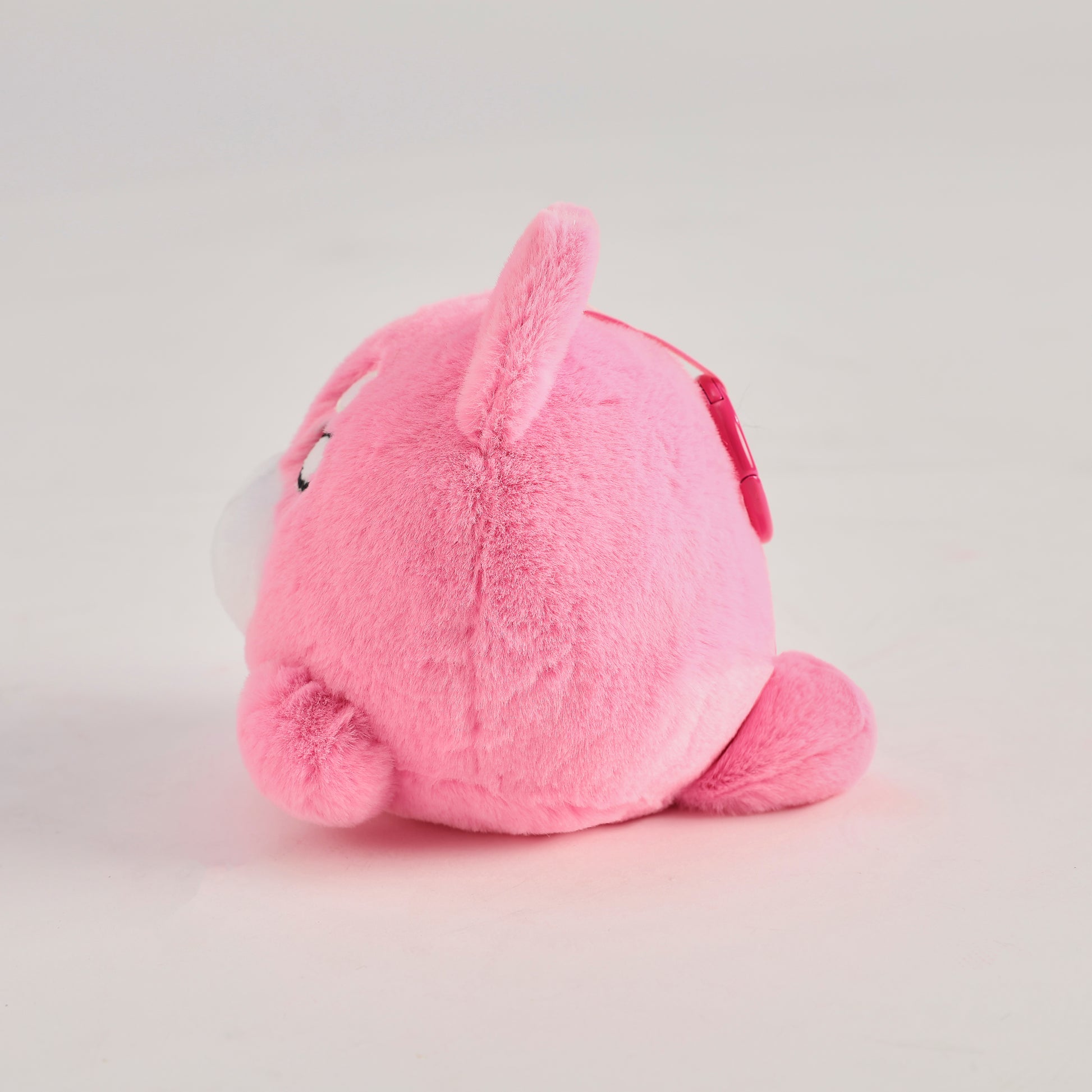 Pink round Wakuma bear plush keychain with chibi-style face, two forehead marks, and small paws.